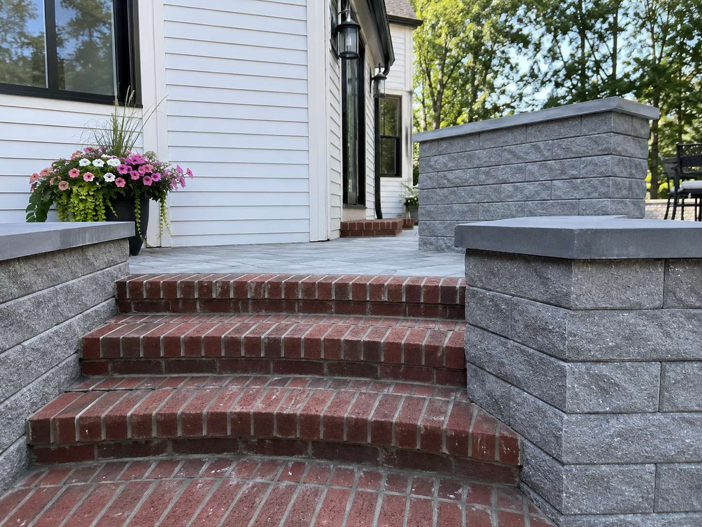 Custom brick stairs with gray block pillars and capstones